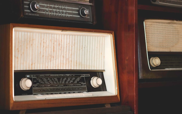 Vintage oldfashioned radio oldfashioned radio placed in vintage\
style wooden cabinets