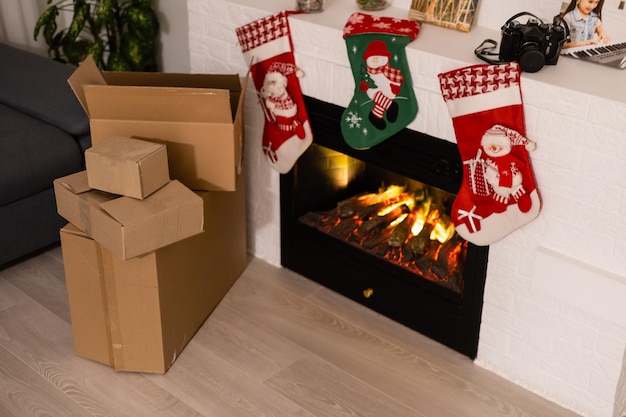 Vintage packages, delivery boxes near fireplace, Christmas