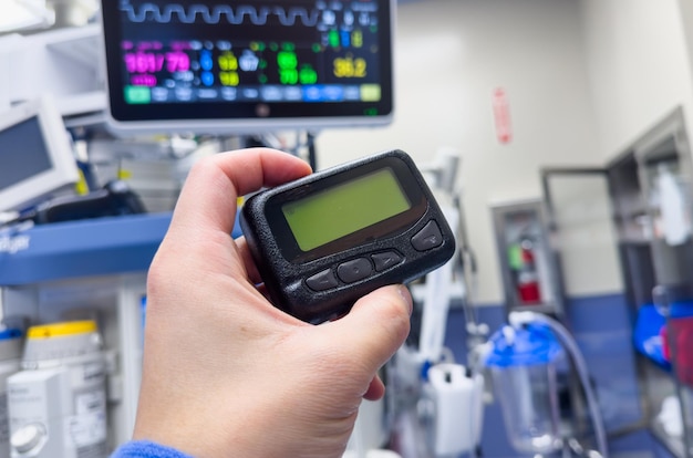 vintage pager on a busy desk symbolizing hectic work life and essential communication in a hospital