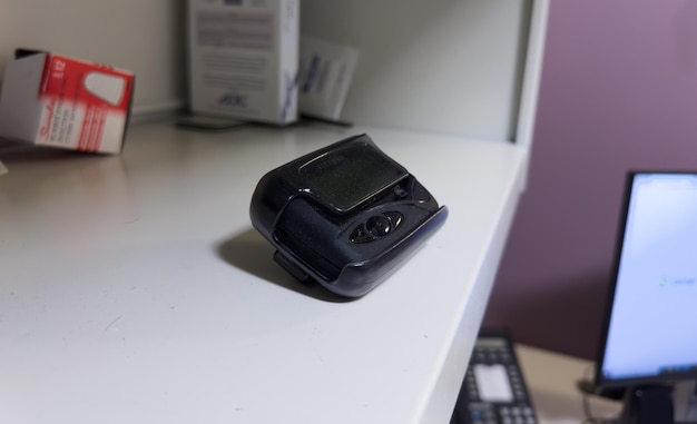 vintage pager on a busy desk symbolizing hectic work life and essential communication in a hospital