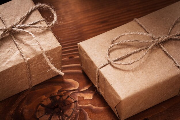 Vintage paper giftboxes on old wooden boards