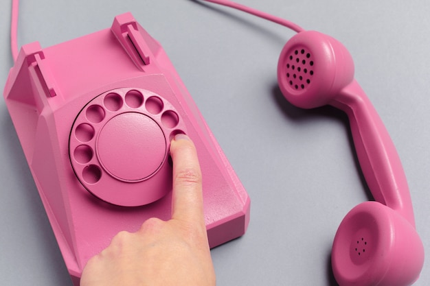 Vintage phone on color background