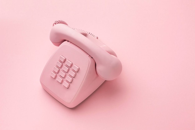 Vintage phone on color background