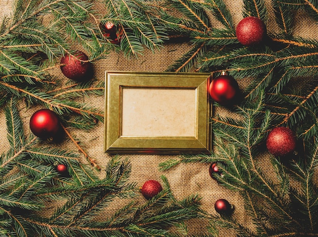 Vintage photo frame on a table next to Christmas decoration