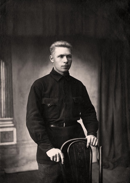 Vintage photo of a young man in typical clothing in the USSR in the 1930s Photo from 1937