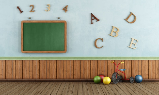 Photo vintage play room with tricycle and balls