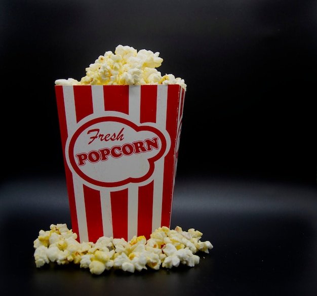 Vintage popcorn box with overflow of popcorn