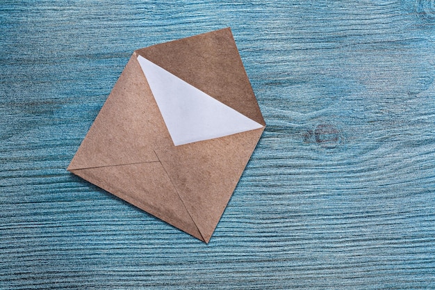 Vintage post envelope with message on wooden board