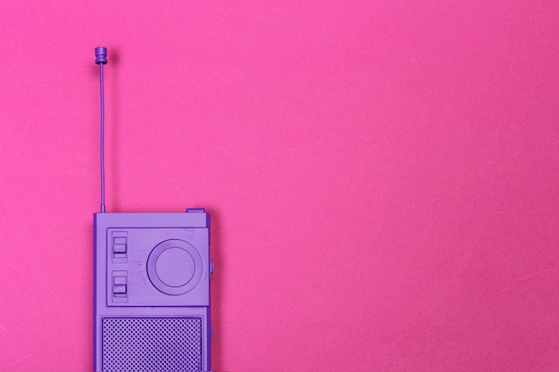 Vintage radio on color background.