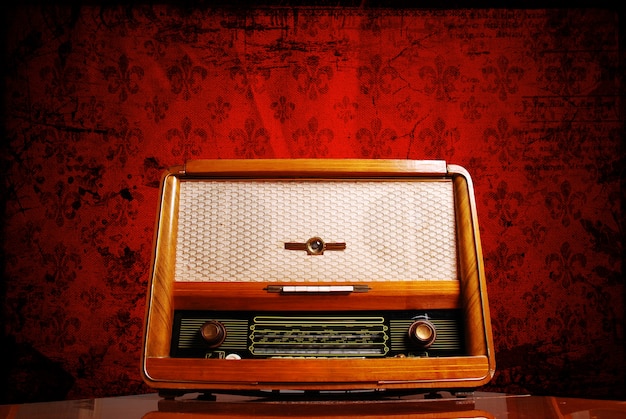 Vintage radio on red background