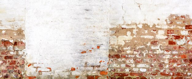 Vintage red brick Wall With Peeled Plaster