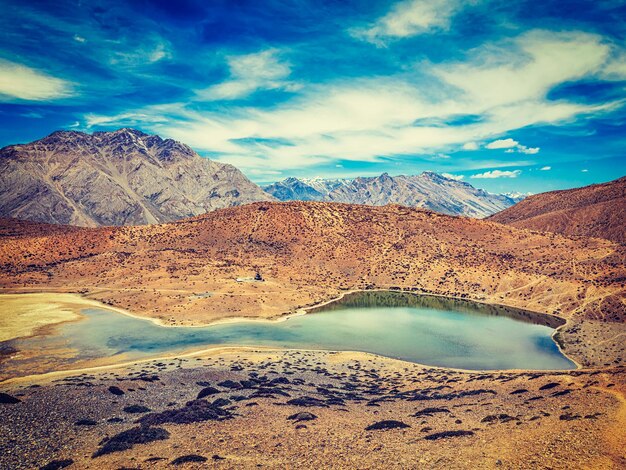 Vintage retro effect filtered hipster style image of dhankar lake in himalayas dhankar spiti valley himachal pradesh india