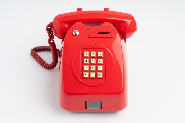 Red telephone. Vintage retro push button telephone isolated on