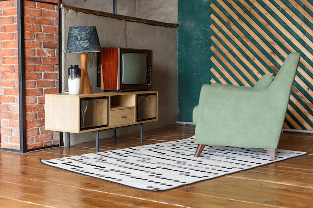 Vintage room with carpet, old fashioned armchair, retro tv