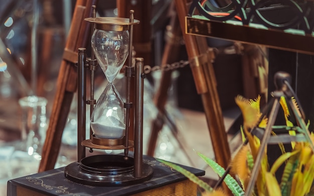 Vintage Sandglass On Old Book 