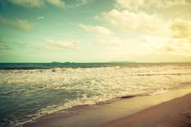 Vintage sea and blue sky clouds on beach in summer.