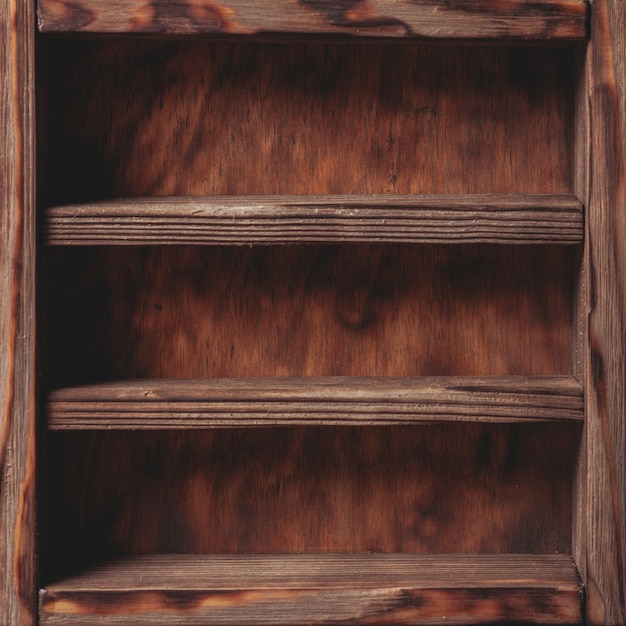 Photo vintage shelf stand on the wooden background