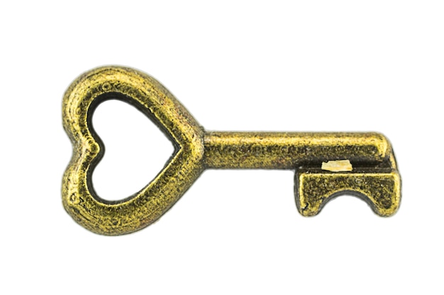 Vintage sleutel antieke gouden sleutel op witte achtergrond Clipping path