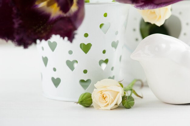 Photo vintage still life. white rose, purple tulips