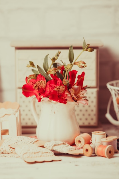 Vintage still life with handcraft materials and flowers