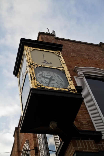 Vintage Street Clock against Partly Cloudy Sky in Ann Arbor