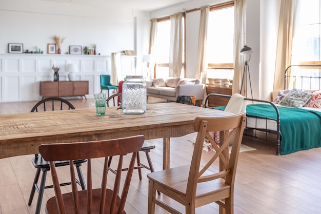 Vintage studio apartment interior in light colors in old style