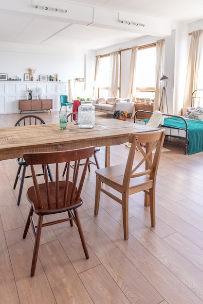 Vintage studio apartment interior in light colors in old style