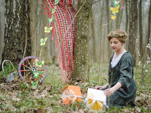 Vintage style picture of a girl playing in the forest