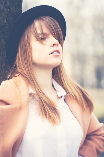 Vintage Style Portrait of Young Beautiful Woman