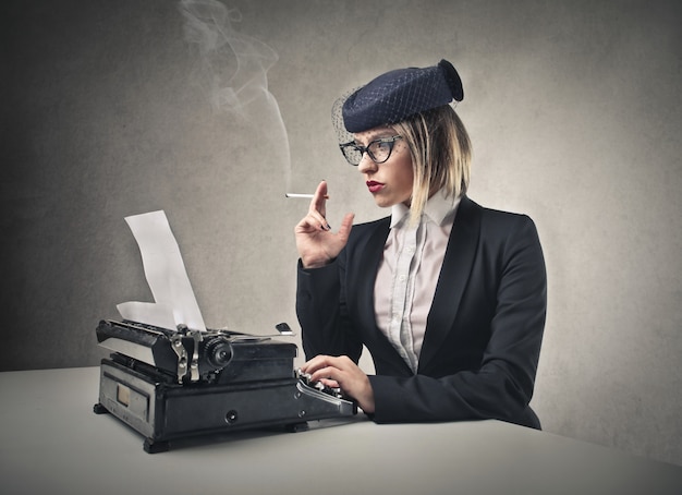 Vintage-style woman and a typewriter 