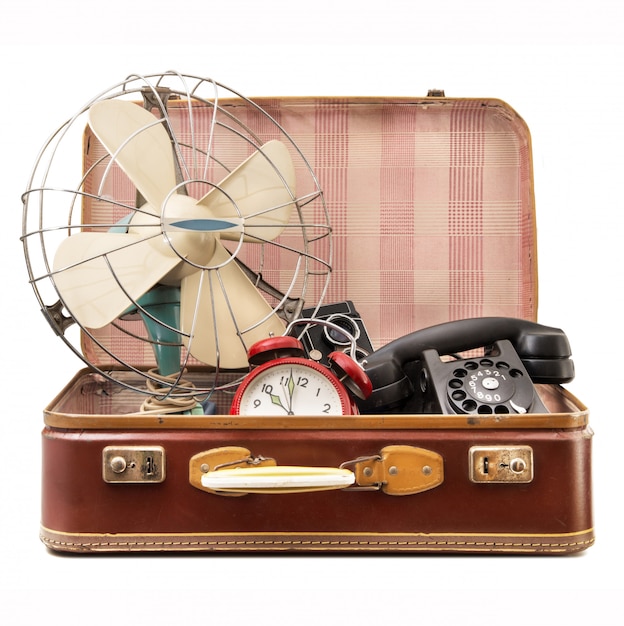 Vintage suitcase full of vintage objects