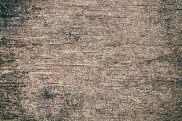 Photo vintage surface wood table and rustic grain texture background. close up of dark rustic wall.