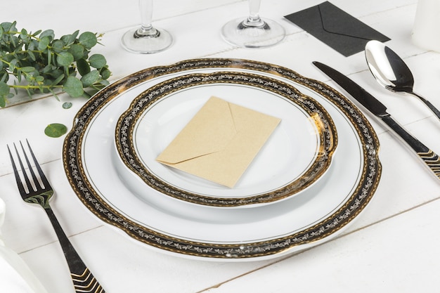 vintage table setting on wooden table with floral decor