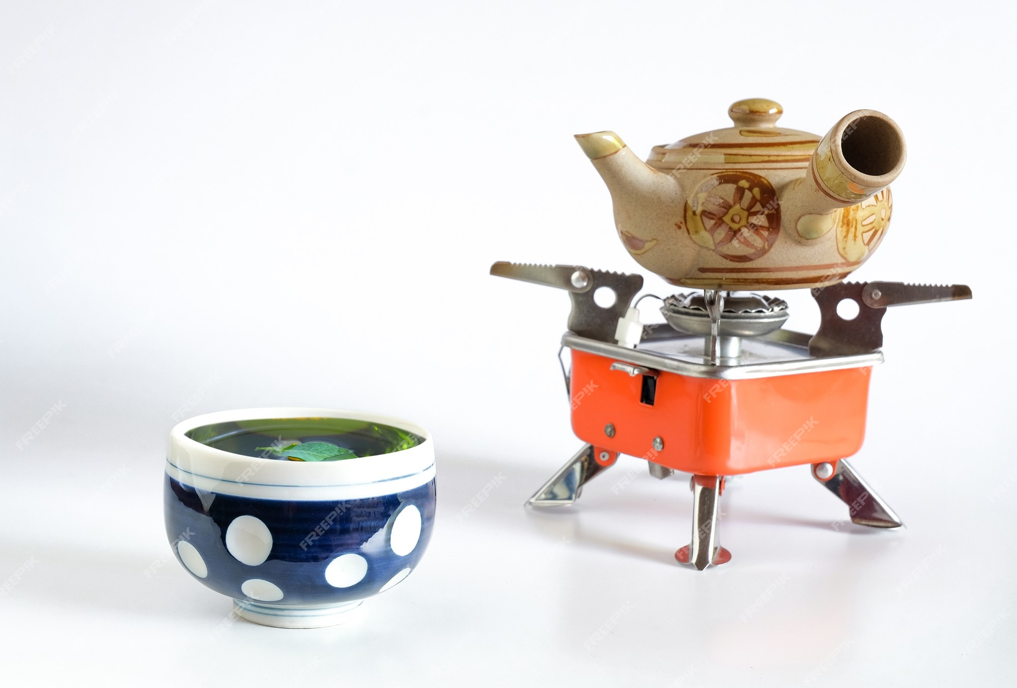 A Camping Tea Kettle On A Propane Stove Next To A Metal Cup Stock Photo,  Picture and Royalty Free Image. Image 42657632.