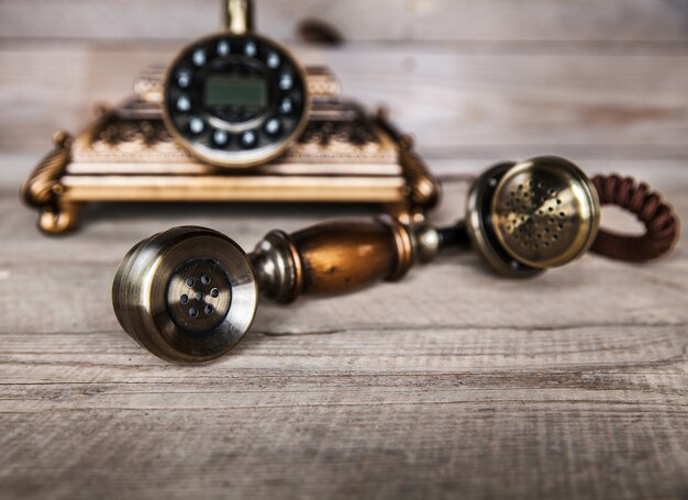 Photo vintage telephone on an old wood table