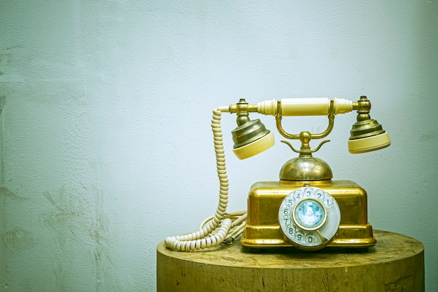 Vintage telephone on retro background