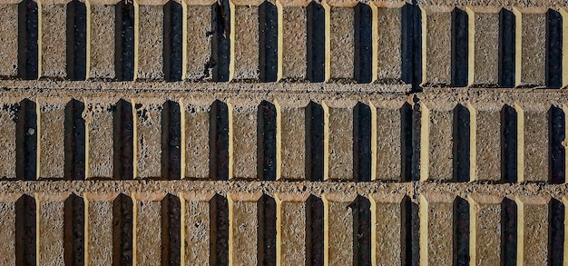 ヴィンテージの織り目加工のレンガの壁