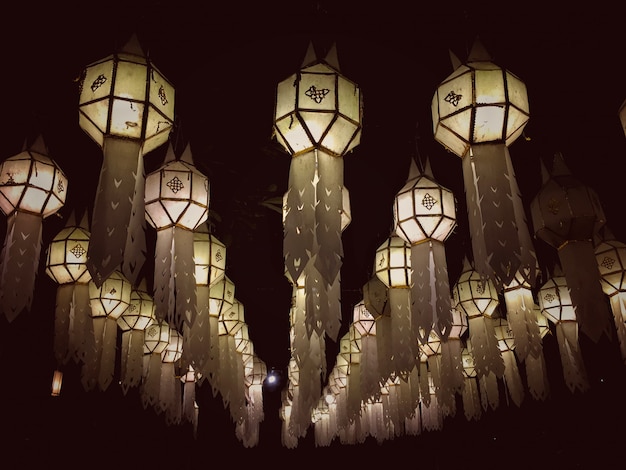 Photo vintage of tissue paper lanterns hanging the floor at night. paper lamps.