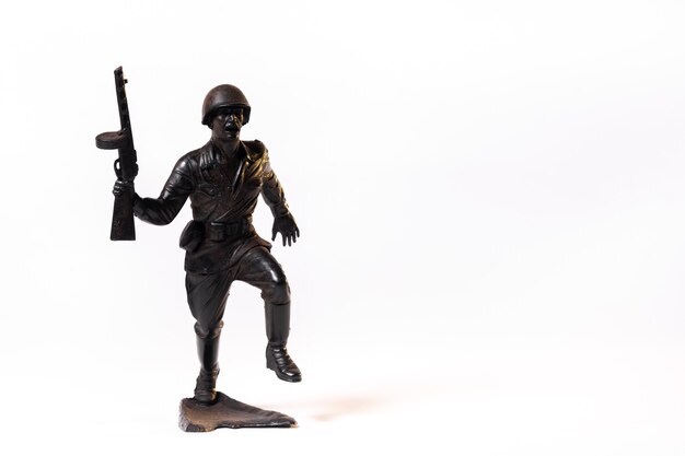 Vintage toy black soldier isolated on white background.