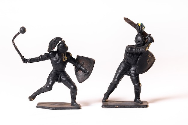 Vintage toys black knights isolated on white background.