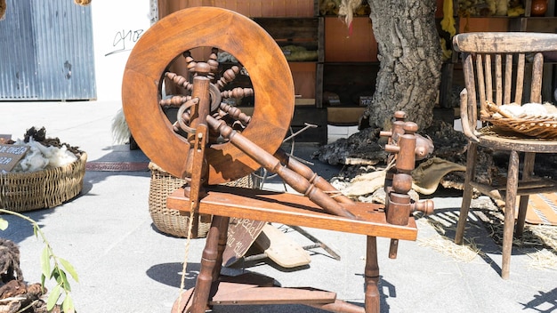 Vintage, traditional spinning wheel for wool yarn, craft ancient instrument