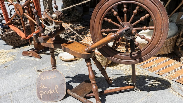 Vintage, traditional spinning wheel for wool yarn, craft ancient instrument