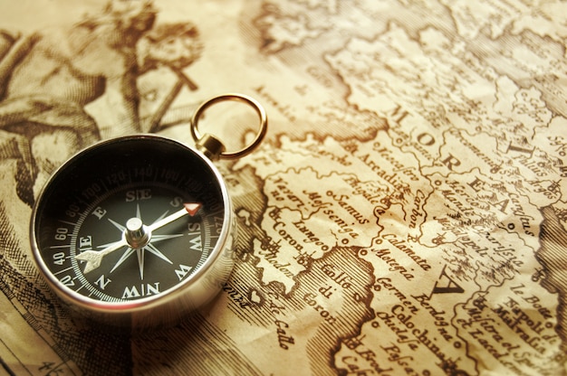 Vintage watch necklace on old world map