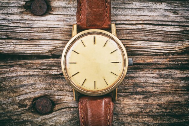 Vintage watch on wooden background