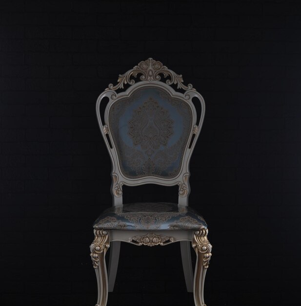 vintage white rich chair on black background