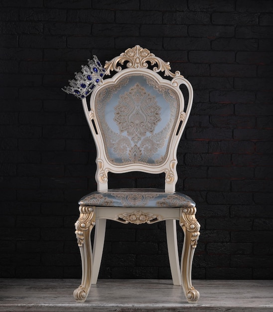 Photo vintage white rich chair on black background