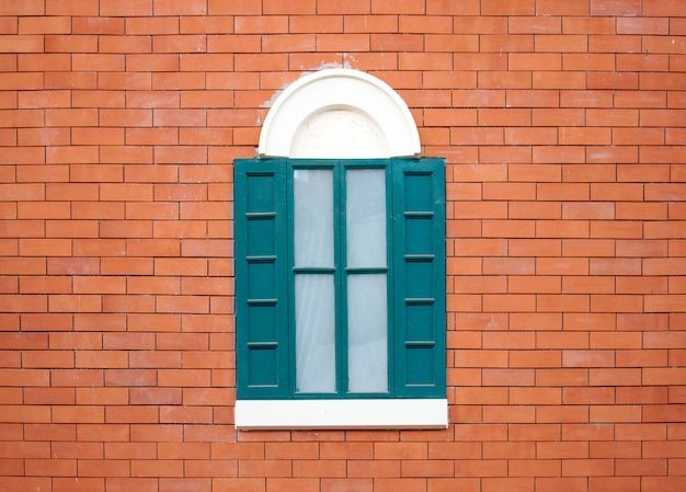 Vintage window on masonry wall