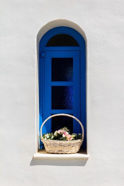 Vintage window with basket of flowers close up