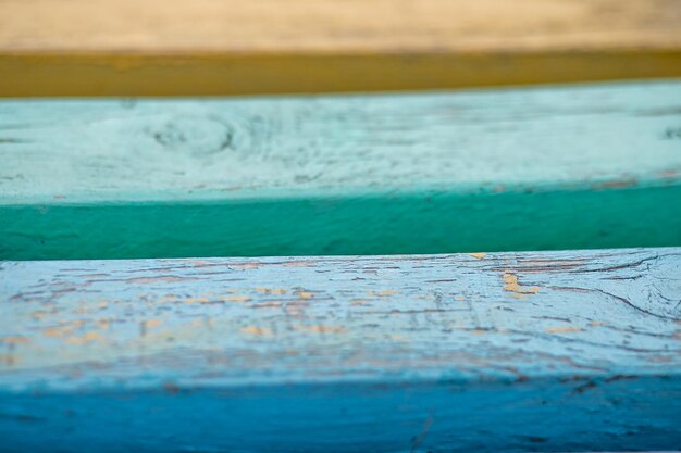 Vintage wooden background with peeling colored paint