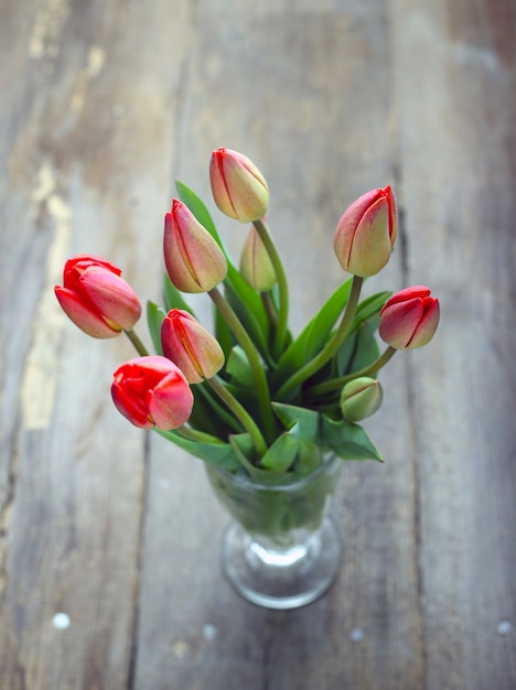 Vintage wooden background with tulips on